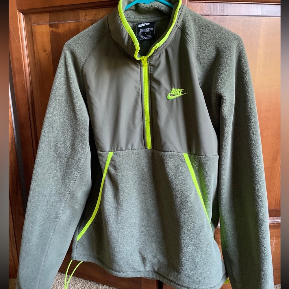 Nike quarter zip with large front pocket.